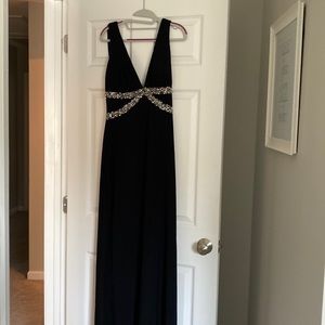 Gorgeous floor length gown.  Back has draping and sequins.